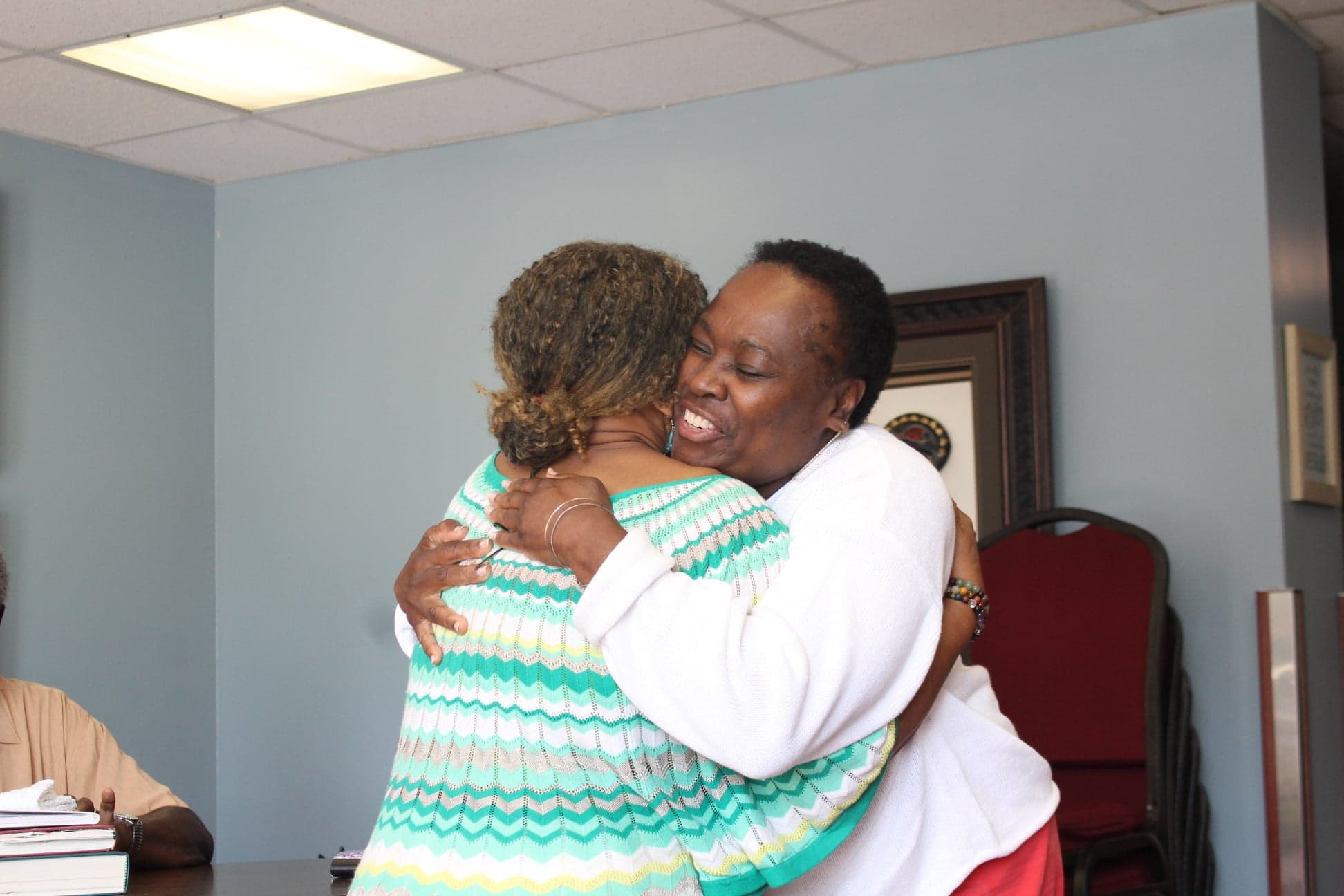 Joy hugging a sister